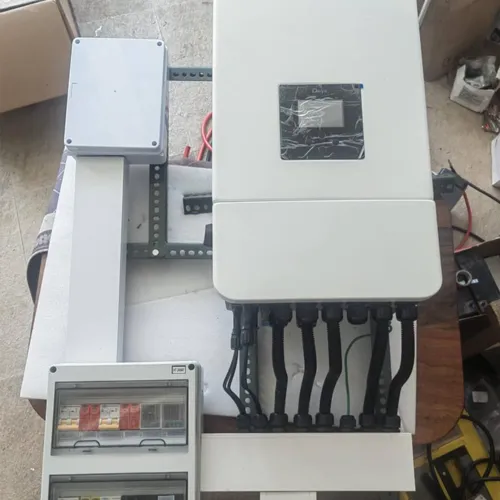 Home energy storage installation with inverter, battery enclosure, and circuit breaker panel