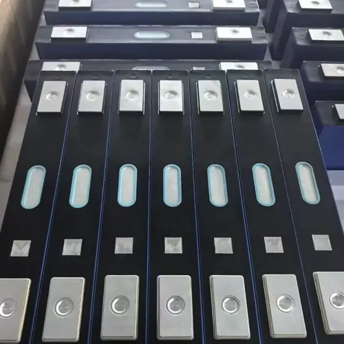 Close-up of lithium battery modules with silver terminal plates and blue oval components