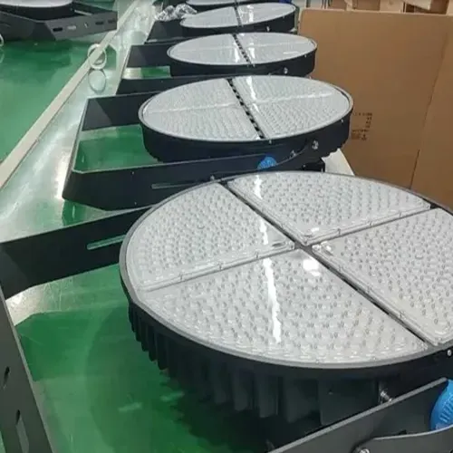 QC Series sports field lights with four LED modules arranged on the factory assembly line