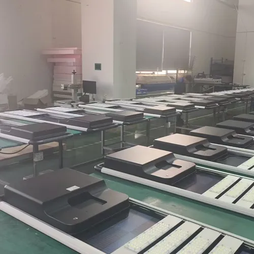 QM Series solar street lights with battery housings arranged for assembly in the factory workshop
