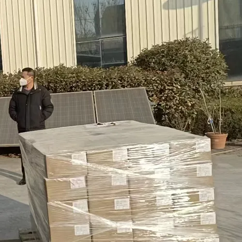 QM Series solar street light cartons and solar panels secured on a pallet before shipment