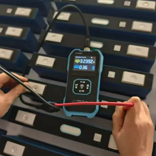 SIB lithium battery units with terminals and carrying handles in a factory