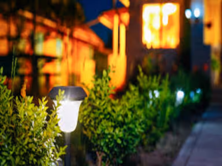 Sungreat Energy modern outdoor solar garden light installed along a villa pathway.