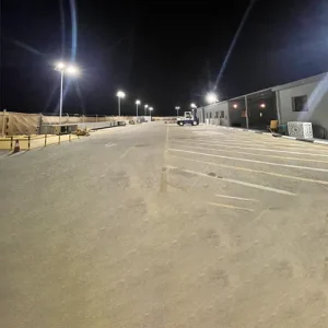 Completed solar street light installation illuminating a Saudi Aramco facility at night