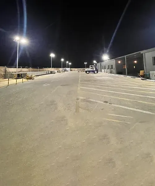 Solar street lights illuminating a Saudi Aramco industrial project site at night