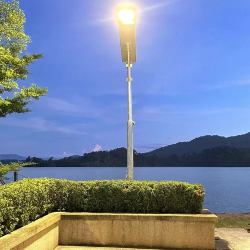 Sungreat Energy BKC Series integrated solar cctv street light illuminating a scenic lakeside promenade at twilight