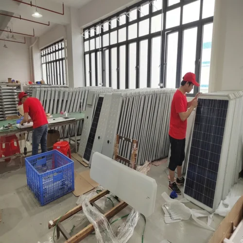 Sungreat Energy DM Series solar street lights being assembled by workers on the factory production line