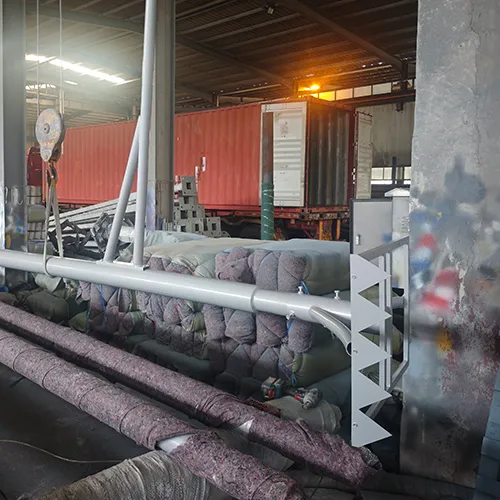 Street light poles being packed and loaded in our factory warehouse with protective wrapping