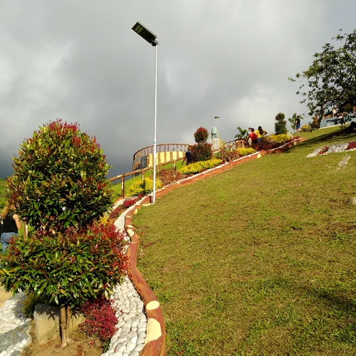 Sungreat Energy BKC Series autonomous solar surveillance light installed along a sloping terraced park landscape in the Philippines