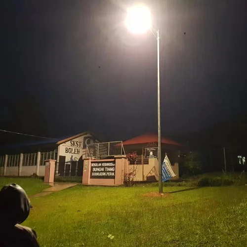 Sungreat Energy BKC series integrated solar camera light illuminating a school entrance gate at night